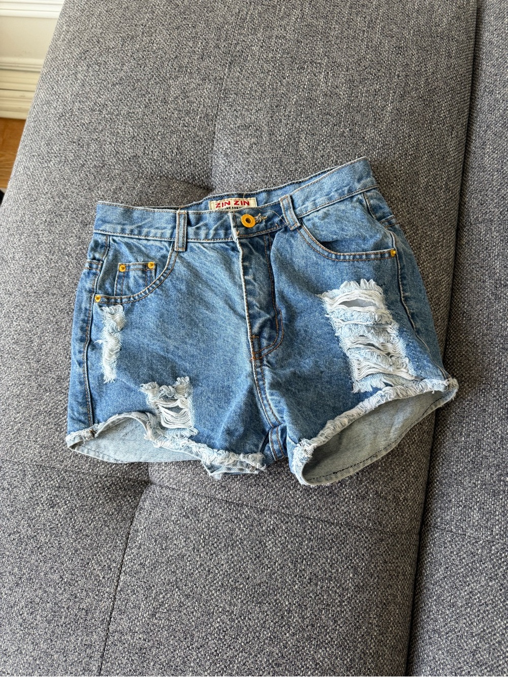 High-Rise Distressed Denim Shorts in Dark Blue